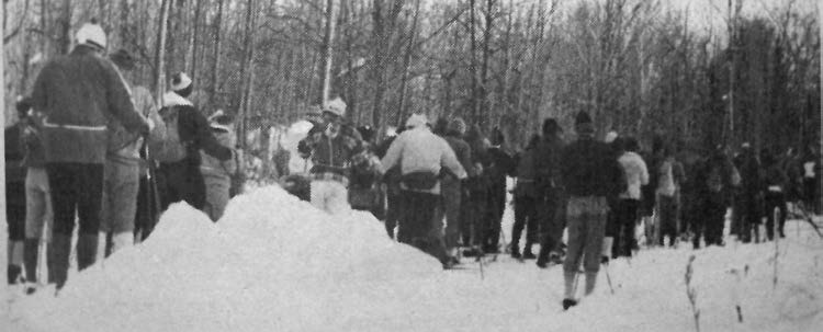 A steady stream of skiers head for the several buses which race organizers provided to transport Loppet participants from the Links-O'Tay Golf Club to the two starting points.