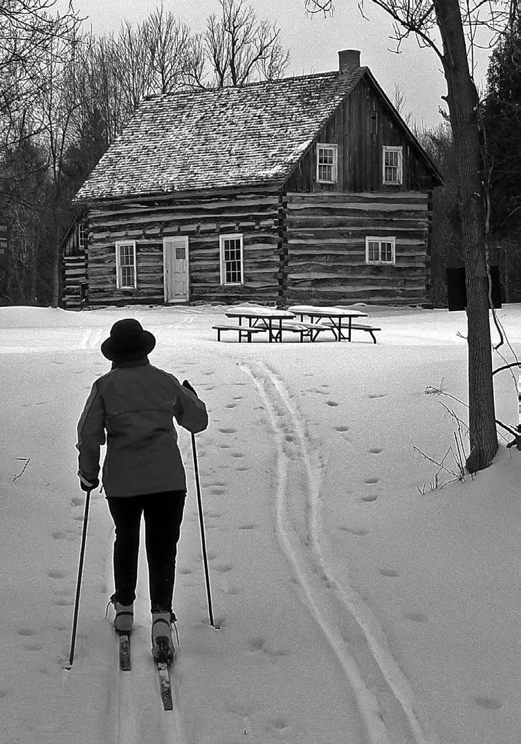 Lone skier approaches McParlan House. Photo: Simon Lunn